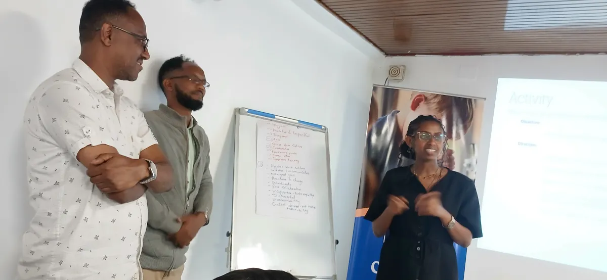Nucleus staff working through a group activity on a whiteboard during the training session