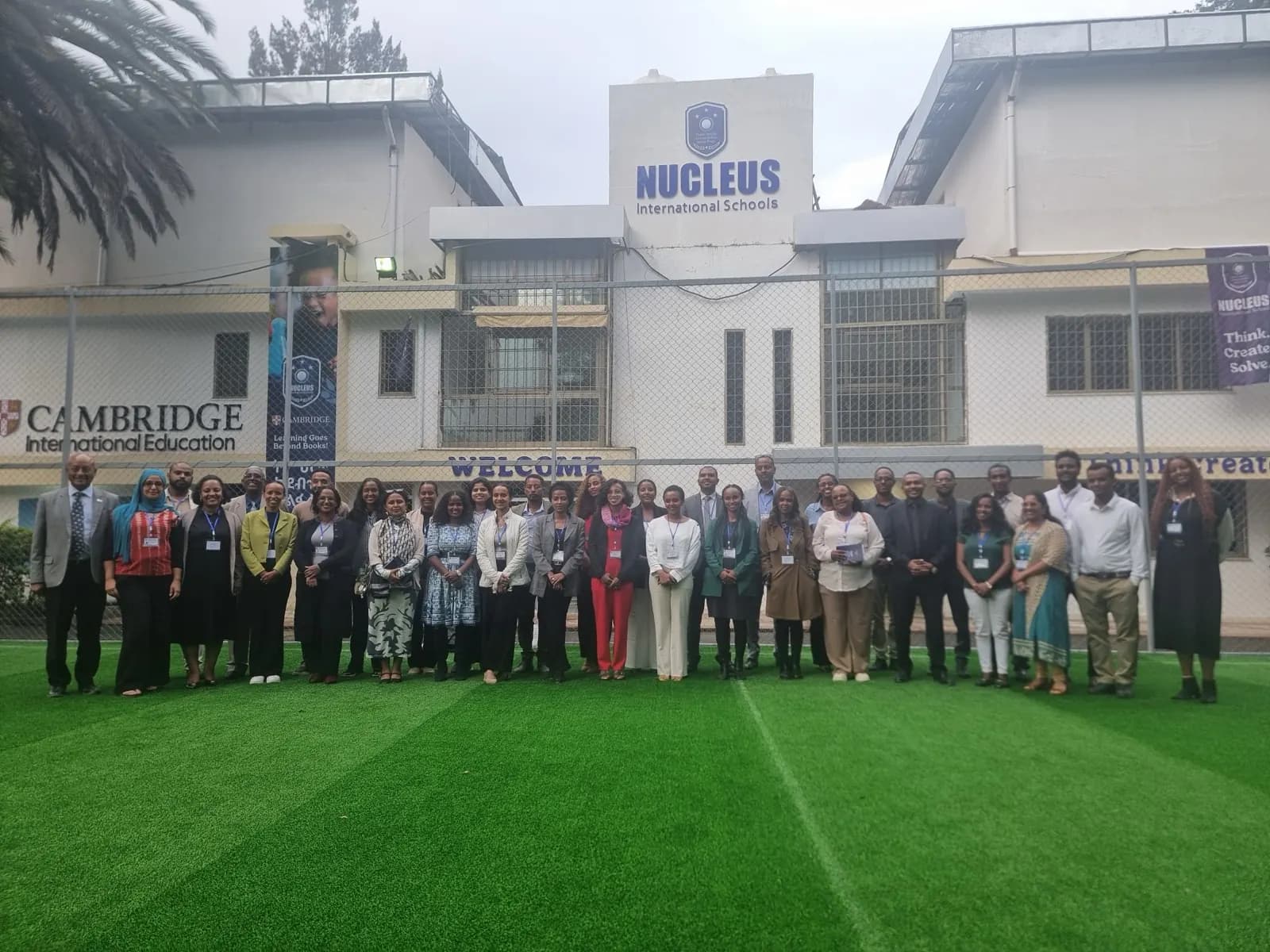 The full Nucleus International Schools teaching and support staff photographed together at the Addis Ababa campus after capacity building training